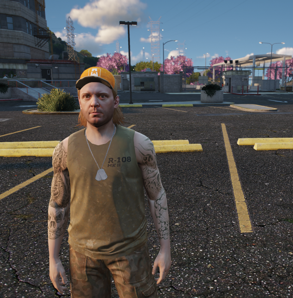 Billy Bob Buttons in a yellow cap and dog tags