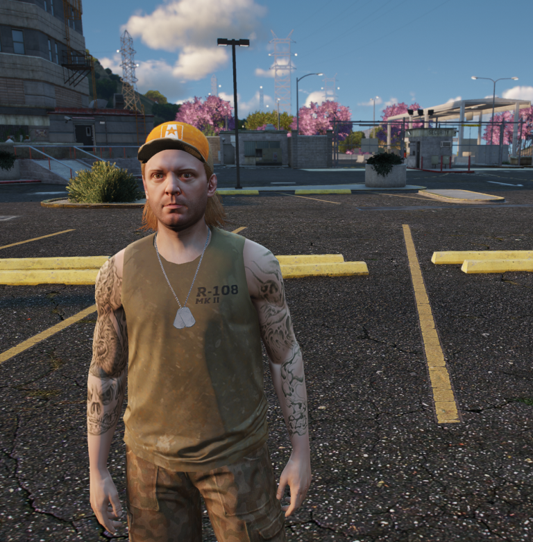 Billy Bob Buttons in a yellow cap and dog tags