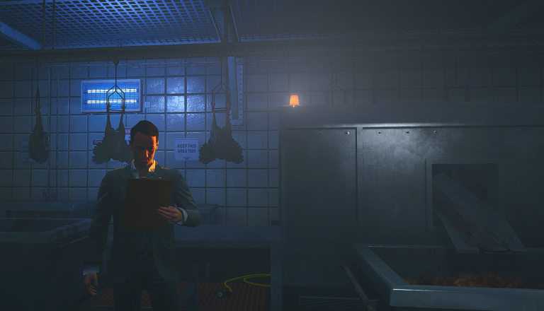 Jack Feebs holding a clipboard in a dim warehouse