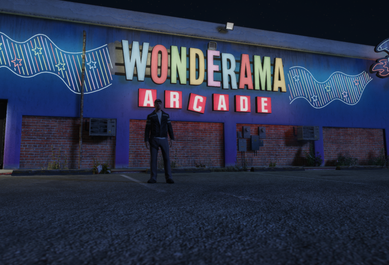 Jet standing outside the neon-lit Wonderama Arcade
