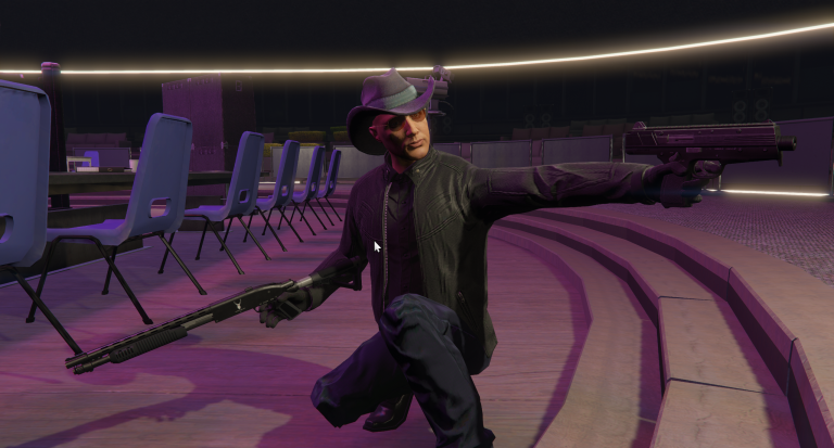 Kevin Frank firing two revolvers inside a theatre