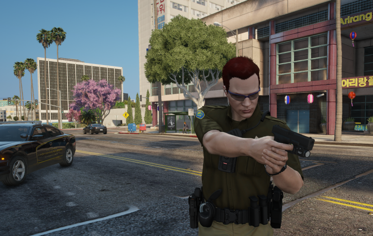 Wade Belson aiming his sidearm during a street stop in Little Seoul