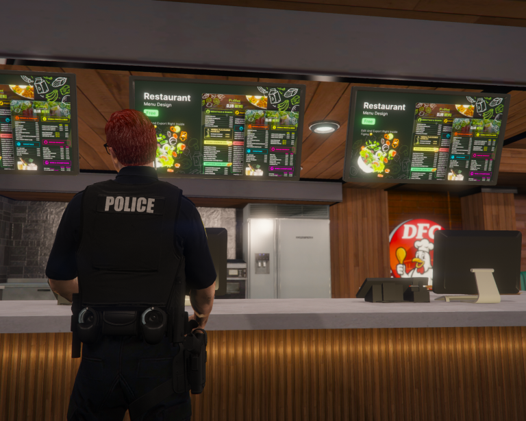 Wade Belson from behind at a fast food counter in uniform