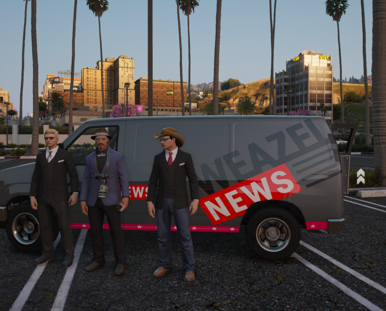 Three Weazel News reporters standing beside the news van