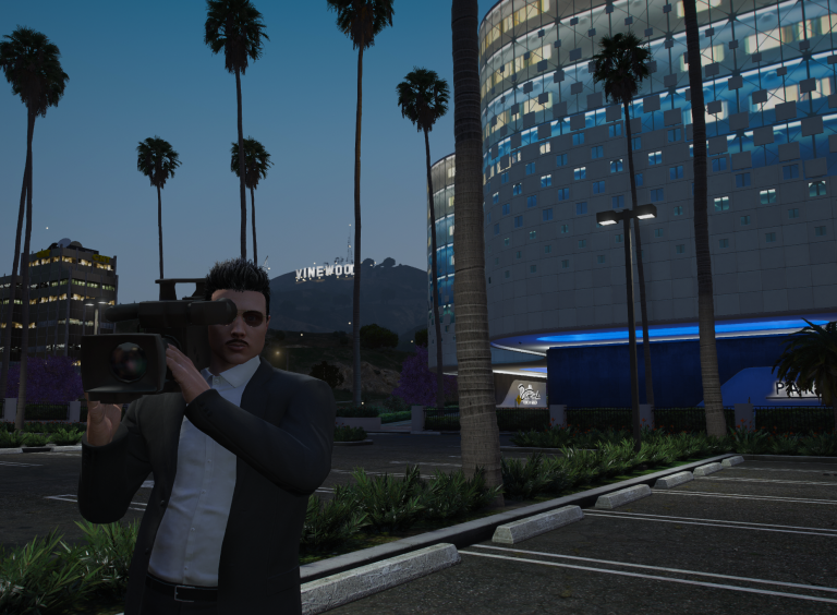 A Weazel News camera operator filming in Vinewood